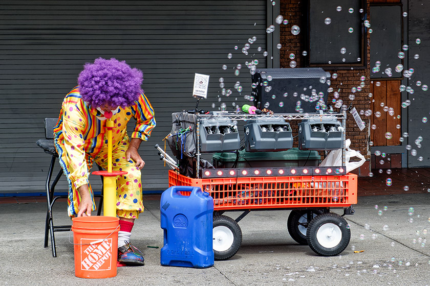 Clown with a soap bubble machine