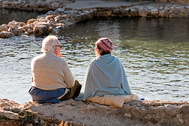 Couple relaxing by the water