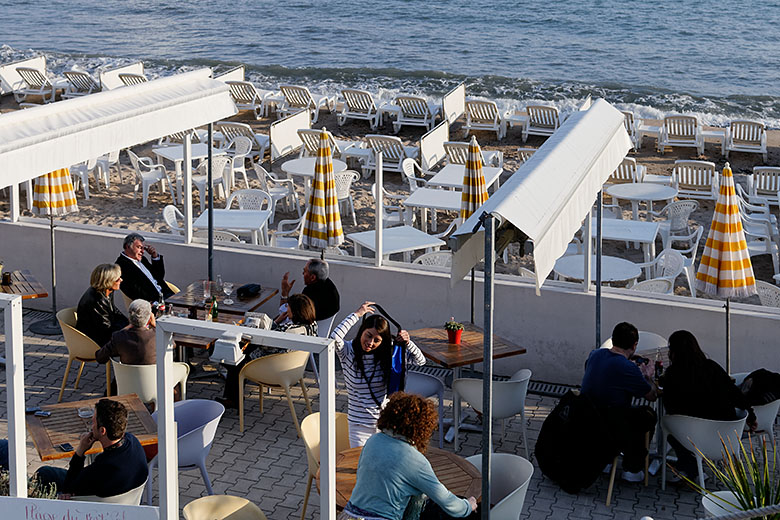 Many cafés are literally built on the beach...