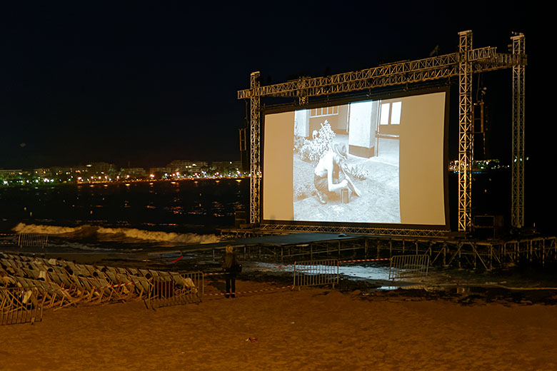 After dark, one can watch classics on the beach...