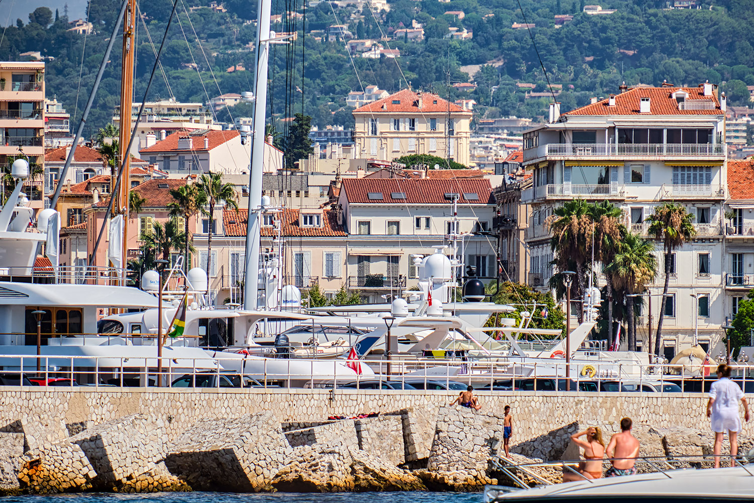 Leaving the Cannes harbor, one has a rare view of the 'Palais Auber' (the big, tan building in the background)