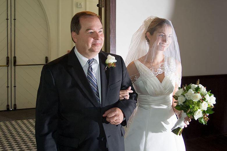 Tom Henry walks his daughter down the aisle