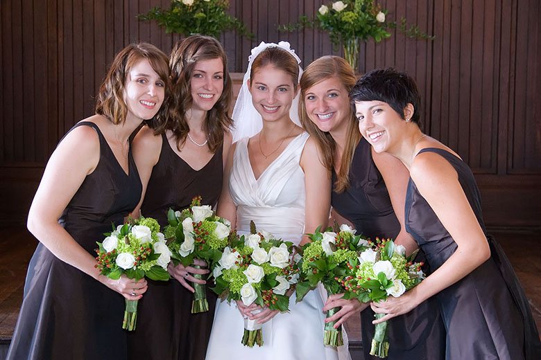 The bride with the maid of honor and the bridesmaids