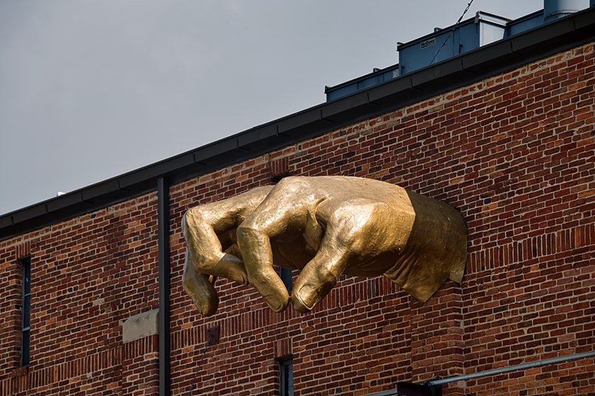 Adam Kurtzman's 'Giant Golden Hand' on the museum façade