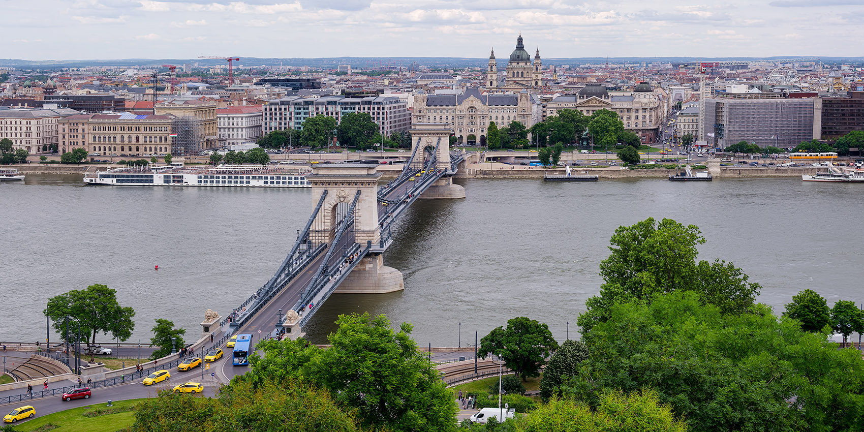 Looking down onto the Széchenyi Chain Bridge from Buda Castle with St. Stephen's Basilica in the background