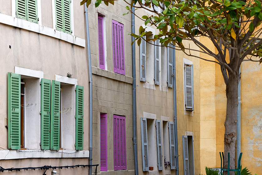Colorful shutters in the 'Traverse Fontaine de Caylus'