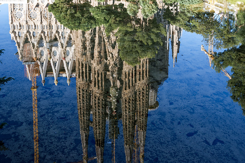 ...and reflected in the Plaça de Gaudi pond.